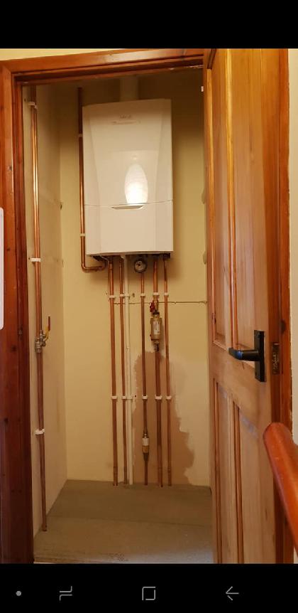 New boiler installation with neatly run copper pipework