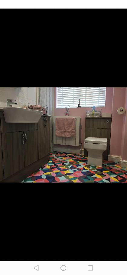 Bathroom refit with colourful geometric floor tiles